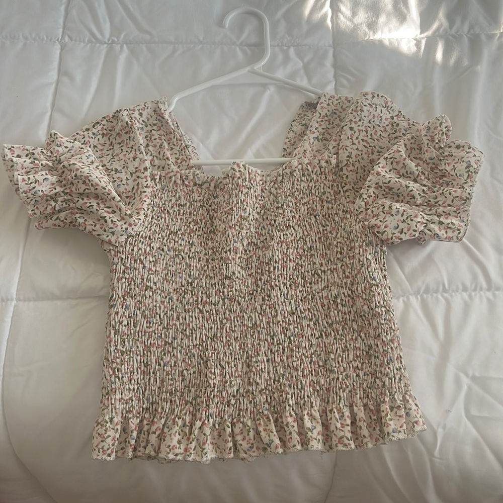 I am selling a puff sleeved SHEIN blouse.